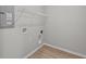 Utility room with wire shelving for storage and wall connections for laundry appliances at 1721 Real St, Indianapolis, IN 46240