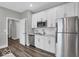 Modern kitchen with stainless steel appliances and white cabinets at 19544 Allenwood Dr, Westfield, IN 46074