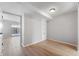Spacious basement room with light gray walls and wood-look flooring at 2634 Country Estates Dr # 17, Indianapolis, IN 46227