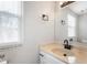 Clean bathroom with updated vanity and a window at 2634 Country Estates Dr # 17, Indianapolis, IN 46227