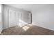 Sunny bedroom with carpeted floor and double doors closet at 2634 Country Estates Dr # 17, Indianapolis, IN 46227
