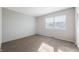 Well-lit bedroom featuring carpeted floors and a textured wall at 2634 Country Estates Dr # 17, Indianapolis, IN 46227