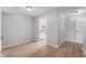 Dining area with light gray walls, wood-look flooring, and kitchen access at 2634 Country Estates Dr # 17, Indianapolis, IN 46227