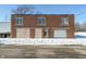 Brick building with garage door and snow on the ground at 3324 Prospect St, Indianapolis, IN 46203