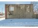 Rear exterior wall of the building, showing cinder block, a window, and utility lines at 3324 Prospect St, Indianapolis, IN 46203
