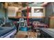 Cluttered garage interior with a loft, various items, and classic cars at 3324 Prospect St, Indianapolis, IN 46203