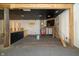 Unfinished interior with stone wall and exposed beams at 3324 Prospect St, Indianapolis, IN 46203