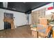 Renovation project: room with exposed walls and hardwood floors at 3324 Prospect St, Indianapolis, IN 46203