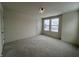 Bright bedroom with neutral walls and carpet at 3406 Preakness St, Whitestown, IN 46075