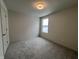 Bright bedroom with carpeted floor and a window offering natural light at 3406 Preakness St, Whitestown, IN 46075