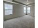 Spacious bedroom with ceiling fan and two windows at 3406 Preakness St, Whitestown, IN 46075