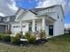 Two-story house with gray siding, white trim, and a covered front porch at 3406 Preakness St, Whitestown, IN 46075