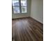Spacious living room with hardwood floors and large windows at 3406 Preakness St, Whitestown, IN 46075