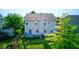 An aerial view of the home's exterior with a green lawn and foliage at 3460 Limelight Ln, Whitestown, IN 46075