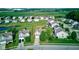 Picturesque aerial view of a residential neighborhood with a pond and green spaces near agricultural area at 3460 Limelight Ln, Whitestown, IN 46075