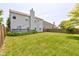Backyard showing the home's green lawn, exterior, and fencing at 3460 Limelight Ln, Whitestown, IN 46075