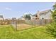 The home's backyard has a plot of land fenced off with a wood fence at 3460 Limelight Ln, Whitestown, IN 46075