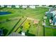 Expansive backyard featuring lush green grass, a wooden fence, and mature trees at 3460 Limelight Ln, Whitestown, IN 46075