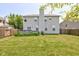 Shot of the backyard featuring the green lawn and back of the house at 3460 Limelight Ln, Whitestown, IN 46075