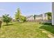 The home has a beautiful yard with trees and pavers that lead to the back porch at 3460 Limelight Ln, Whitestown, IN 46075