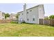 View of the home's backyard featuring a well-kept lawn and a back deck at 3460 Limelight Ln, Whitestown, IN 46075