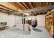 Finished basement with a comfy couch, entertainment center, and built-in shelving at 3460 Limelight Ln, Whitestown, IN 46075