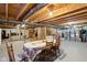 Spacious basement with a dining table, storage area, and entertainment center at 3460 Limelight Ln, Whitestown, IN 46075