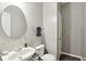Small bathroom with white sink, toilet, and oval mirror at 3460 Limelight Ln, Whitestown, IN 46075