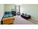 bedroom with Minecraft bedding, toy storage, and a comfy chair at 3460 Limelight Ln, Whitestown, IN 46075