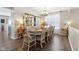 Formal dining room with a large table, chandelier, and hutch at 3460 Limelight Ln, Whitestown, IN 46075