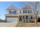 Two-story house with brick and siding exterior, attached garage, and front porch at 3460 Limelight Ln, Whitestown, IN 46075