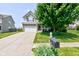 Inviting two-story home with brick and siding, attached two-car garage, and a well-kept front lawn at 3460 Limelight Ln, Whitestown, IN 46075