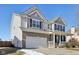 Two-story house with brick and siding exterior, attached garage, and front porch at 3460 Limelight Ln, Whitestown, IN 46075