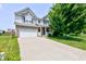 Inviting two-story home with brick and siding, attached two-car garage, and a well-kept front lawn at 3460 Limelight Ln, Whitestown, IN 46075