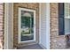 Inviting front door with decorative glass and brick accents for a warm welcome at 3460 Limelight Ln, Whitestown, IN 46075