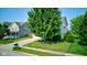 Charming two-story home with a well-manicured lawn and mature tree in a suburban neighborhood at 3460 Limelight Ln, Whitestown, IN 46075