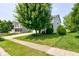 Charming two-story home with a well-manicured lawn and mature tree in a suburban neighborhood at 3460 Limelight Ln, Whitestown, IN 46075