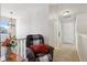 Upstairs hallway with comfortable seating and a window at 3460 Limelight Ln, Whitestown, IN 46075