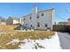 Two-story house exterior with backyard, deck, and snow on the ground at 3460 Limelight Ln, Whitestown, IN 46075