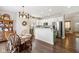 Kitchen with a round dining table, white cabinets, and hardwood floors at 3460 Limelight Ln, Whitestown, IN 46075