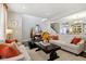 Open living room with two sofas and a coffee table, fall decor at 3460 Limelight Ln, Whitestown, IN 46075