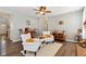 Cozy living room with two comfortable armchairs, a coffee table, and hardwood floors at 3460 Limelight Ln, Whitestown, IN 46075