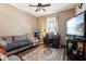 Bright and airy home office with a comfortable sofa and workspace at 3460 Limelight Ln, Whitestown, IN 46075