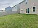 View of the home's spacious backyard with a wooden fence and well-maintained lawn at 371 Traditions Pass, Greenwood, IN 46143