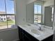 Bright bathroom with a double sink vanity, large mirror, and natural light at 371 Traditions Pass, Greenwood, IN 46143