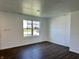 Bright living room with hardwood floors and a large window at 371 Traditions Pass, Greenwood, IN 46143