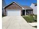 Charming single-story brick home with a two-car garage and manicured lawn at 5154 Bramwell Ln, Whitestown, IN 46075