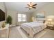 Tranquil bedroom featuring neutral walls, a plush bed, and a ceiling fan at 6540 Avalon Blvd, Avon, IN 46123