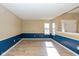 Bright dining room with blue wainscoting and hardwood floor at 6540 Avalon Blvd, Avon, IN 46123