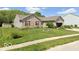 Brick ranch home with landscaped yard and attached garage at 6540 Avalon Blvd, Avon, IN 46123